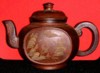 Brown clay tea cup with design